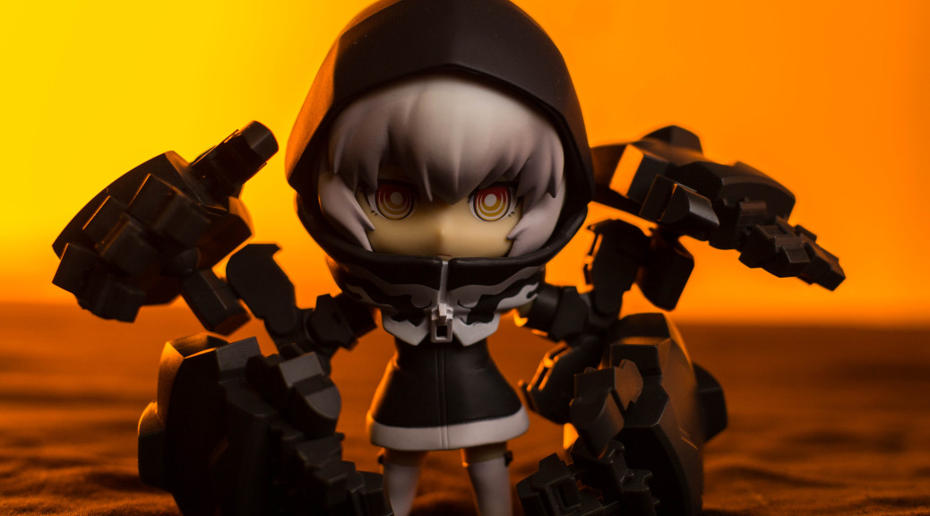 a toy figure wearing black armor